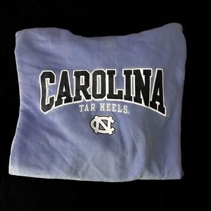 UNC champion hoodie. Light blue with embroidered lettering.